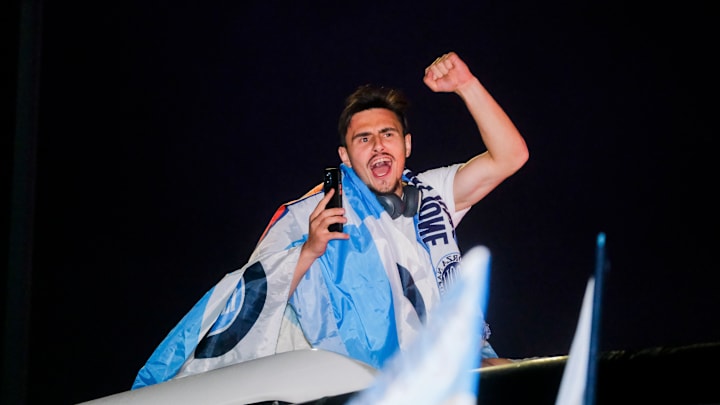 SSc Napoli's midfielder Eljif Elmas greets fans on the bus...