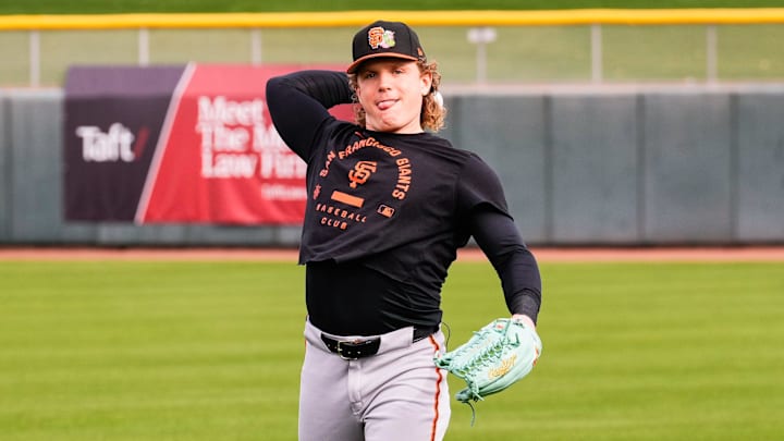 San Francisco Giants outfielder Harrison Bader throws during workouts.