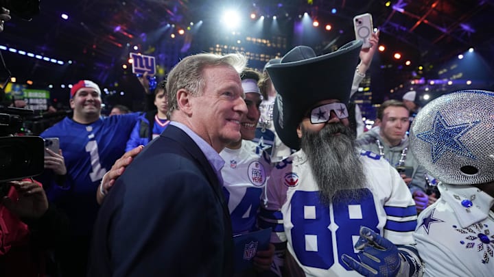 NFL Commissioner Roger Goodell poses with fans during the 2024 NFL Draft.