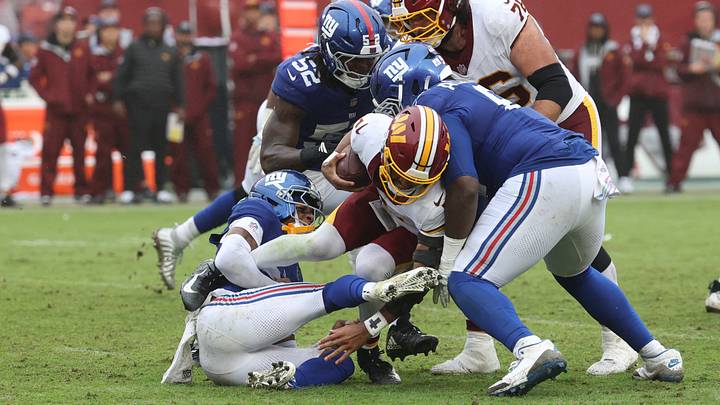 Oct 11, 2026; Landover, Maryland, USA; Washington Commanders quarterback Jayden Daniels (5) is sacked by New York Giants cornerback Dru Phillips (22) during the fourth quarter at Northwest Stadium. Mandatory Credit: Geoff Burke-Imagn Images Oct 11, 2026; Landover, Maryland, USA; Washington Commanders quarterback Jayden Daniels (5) is sacked by New York Giants cornerback Dru Phillips (22) during the fourth quarter at Northwest Stadium. Mandatory Credit: Geoff Burke-Imagn Images
