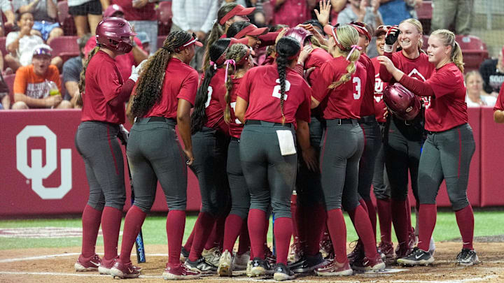 Freshman catcher Kendall Wells hits a home run during the game against Oklahoma Christian University at Love’s Field on Wednesday in Norman, Okla.