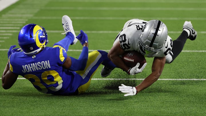 Aug 19, 2023; Inglewood, California, USA;  Las Vegas Raiders wide receiver Tre Tucker (89) catches a pass against Los Angeles Rams safety Quindell Johnson (39) during the fourth quarter at SoFi Stadium. Mandatory Credit: Kiyoshi Mio-Imagn Images