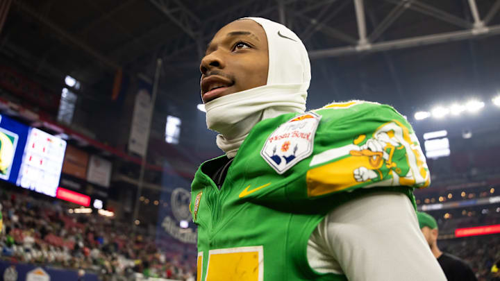 Jan 1, 2024; Glendale, AZ, USA; Oregon Ducks wide receiver Tez Johnson (15) against the Liberty Flames during the 2024 Fiesta Bowl at State Farm Stadium. Mandatory Credit: Mark J. Rebilas-Imagn Images Jan 1, 2024; Glendale, AZ, USA; Oregon Ducks wide receiver Tez Johnson (15) against the Liberty Flames during the 2024 Fiesta Bowl at State Farm Stadium. Mandatory Credit: Mark J. Rebilas-Imagn Images