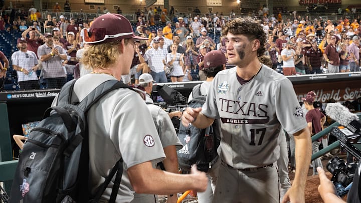 Jun 24, 2024; Omaha, NE, USA;  Texas A&M Aggies right fielder Jace Laviolette (17) greets players after the loss against the Tennessee Volunteers at Charles Schwab Field Omaha. Mandatory Credit: Steven Branscombe-Imagn Images