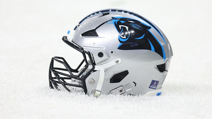 Dec 14, 2025; New Orleans, Louisiana, USA; Detailed shot of a Carolina Panthers helmet on the grass before the game against the New Orleans Saints at Caesars Superdome. Mandatory Credit: Stephen Lew-Imagn Images