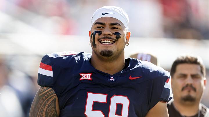 Nov 22, 2025; Tucson, Arizona, USA; Arizona Wildcats offensive lineman Rhino Tapa'atoutai (59) against the Baylor Bears at Casino Del Sol Stadium. Mandatory Credit: Mark J. Rebilas-Imagn Images