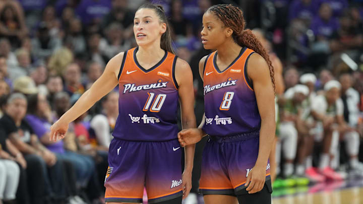 May 17, 2025; Phoenix, Arizona, USA; Phoenix Mercury guard Sevgi Uzun (10) talks with Seattle Storm guard Lexie Brown (8) during the first half of the game against the Seattle Storm at Footprint Center. Mandatory Credit: Joe Camporeale-Imagn Images