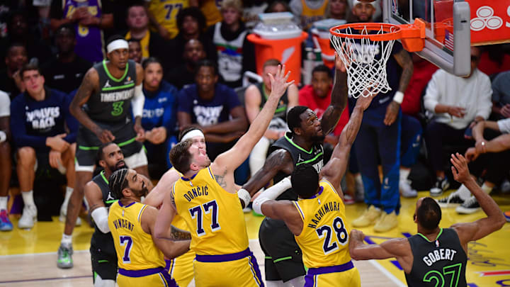 Apr 30, 2025; Los Angeles, California, USA; Minnesota Timberwolves forward Julius Randle (30) shoots against Los Angeles Lakers guard Gabe Vincent (7) guard Luka Doncic (77) and forward Rui Hachimura (28) during the second half in game five of first round for the 2025 NBA Playoffs at Crypto.com Arena. Mandatory Credit: Gary A. Vasquez-Imagn Images