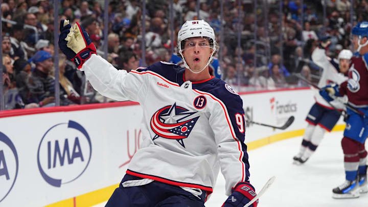 Oct 12, 2024; Denver, Colorado, USA; Columbus Blue Jackets center Kent Johnson (91) celebrates his goal scored in the first period against the Colorado Avalanche at Ball Arena. Mandatory Credit: Ron Chenoy-Imagn Images
