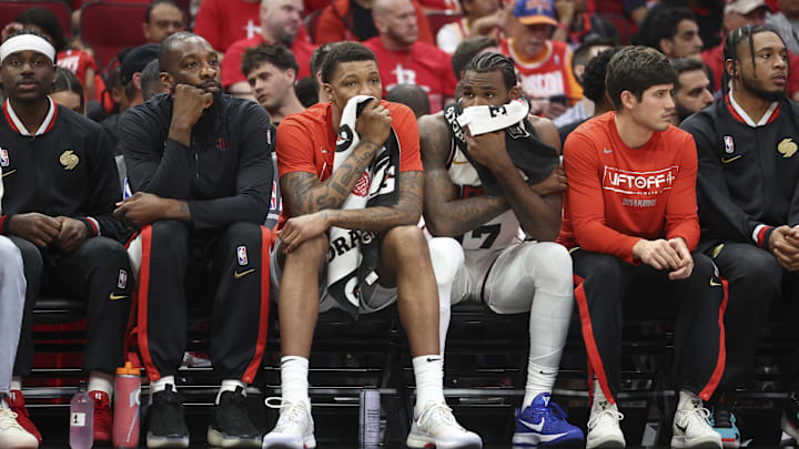 May 4, 2025; Houston, Texas, USA; Houston Rockets forward Jabari Smith Jr. (middle left) and forward Tari Eason (middle right) hold towels on their faces during game seven of the first round for the 2025 NBA Playoffs against the Golden State Warriors at Toyota Center. Mandatory Credit: Troy Taormina-Imagn Images