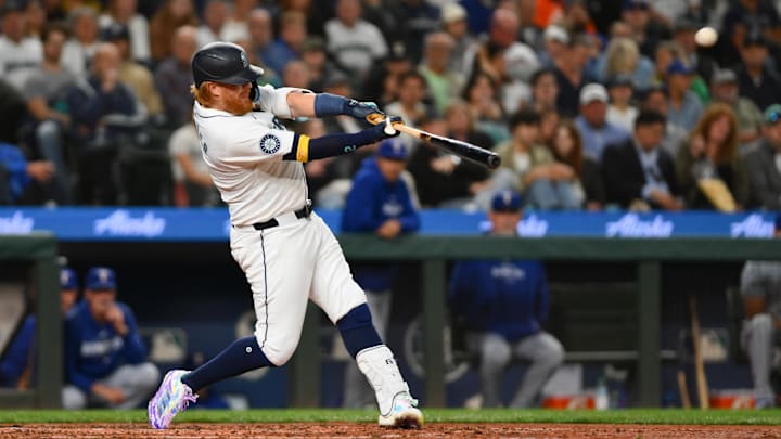 Sep 12, 2024; Seattle, Washington, USA; Seattle Mariners designated hitter Justin Turner (2) hits a home run against the Texas Rangers during the fourth inning at T-Mobile Park.