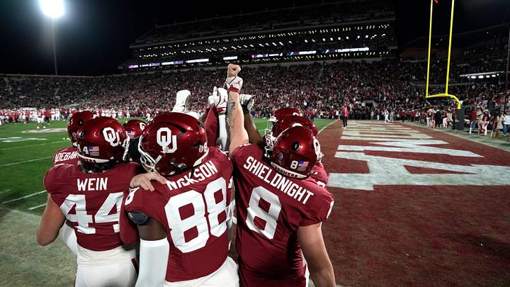Oklahoma players gather before a first-round College Football Playoff game between the University of Oklahoma Sooners (OU) and the Alabama Crimson Tide at Gaylord Family - Oklahoma Memorial Stadium Oklahoma players gather before a first-round College Football Playoff game between the University of Oklahoma Sooners (OU) and the Alabama Crimson Tide at Gaylord Family - Oklahoma Memorial Stadium