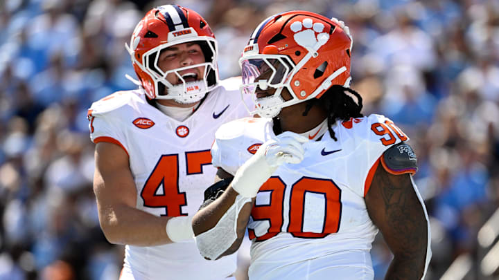 Oct 4, 2025; Chapel Hill, North Carolina, USA; Clemson Tigers defensive tackle Stephiylan Green (90) reacts with linebacker Sammy Brown (47) in the second quarter at Kenan Stadium. Mandatory Credit: Bob Donnan-Imagn Images Oct 4, 2025; Chapel Hill, North Carolina, USA; Clemson Tigers defensive tackle Stephiylan Green (90) reacts with linebacker Sammy Brown (47) in the second quarter at Kenan Stadium. Mandatory Credit: Bob Donnan-Imagn Images
