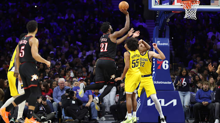 Dec 12, 2025; Philadelphia, Pennsylvania, USA; Philadelphia 76ers center Joel Embiid (21) drives for a shot against Indiana Pacers center Jay Huff (32) and guard Ethan Thompson (55) during the third quarter at Xfinity Mobile Arena. Mandatory Credit: Bill Streicher-Imagn Images Dec 12, 2025; Philadelphia, Pennsylvania, USA; Philadelphia 76ers center Joel Embiid (21) drives for a shot against Indiana Pacers center Jay Huff (32) and guard Ethan Thompson (55) during the third quarter at Xfinity Mobile Arena. Mandatory Credit: Bill Streicher-Imagn Images