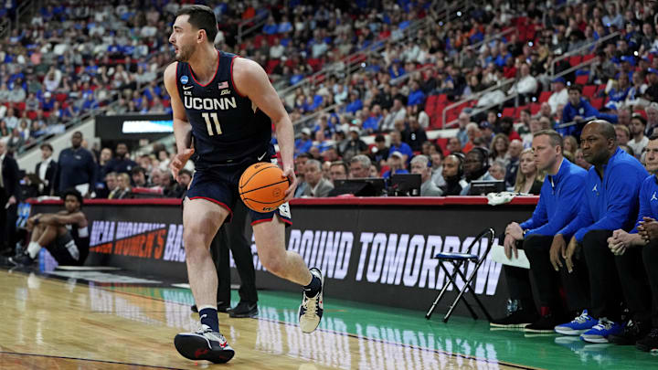 Mar 23, 2025; Raleigh, NC, USA; Connecticut Huskies forward Alex Karaban (11) drives to the basket during the first half against the Florida Gators in the second round of the NCAA Tournament at Lenovo Center. Mandatory Credit: Bob Donnan-Imagn Images