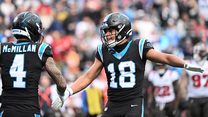 Dec 21, 2025; Charlotte, North Carolina, USA; Carolina Panthers wide receiver Jalen Coker (18) celebrates with wide receiver Tetairoa McMillan (4) after a play during the first half against the Tampa Bay Buccaneers at Bank of America Stadium. Mandatory Credit: Bob Donnan-Imagn Images Dec 21, 2025; Charlotte, North Carolina, USA; Carolina Panthers wide receiver Jalen Coker (18) celebrates with wide receiver Tetairoa McMillan (4) after a play during the first half against the Tampa Bay Buccaneers at Bank of America Stadium. Mandatory Credit: Bob Donnan-Imagn Images