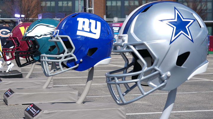 Feb 27, 2025; Indianapolis, IN, USA; NFC East helmets of the Dallas Cowboys, New York Giants, Philadelphia Eagles and Washington Commanders at the 2025 NFL Scouting Combine Experience at Lucas Oil Stadium. Mandatory Credit: Kirby Lee-Imagn Images Feb 27, 2025; Indianapolis, IN, USA; NFC East helmets of the Dallas Cowboys, New York Giants, Philadelphia Eagles and Washington Commanders at the 2025 NFL Scouting Combine Experience at Lucas Oil Stadium. Mandatory Credit: Kirby Lee-Imagn Images