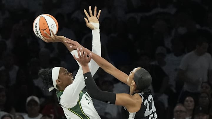Sep 14, 2025; Las Vegas, Nevada, USA; Seattle Storm center Dominique Malonga (14) shoots against Las Vegas Aces center A'ja Wilson (22) in the first quarter during game one of round one for the 2025 WNBA Playoffs at Michelob Ultra Arena. Mandatory Credit: Candice Ward-Imagn Images