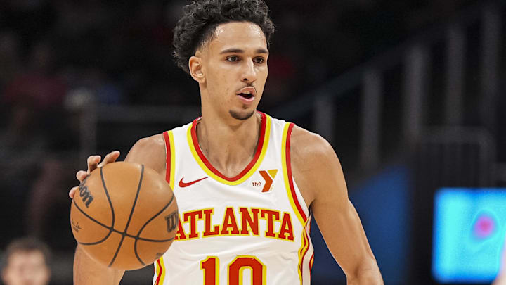 Apr 1, 2025; Atlanta, Georgia, USA; Atlanta Hawks forward Zaccharie Risacher (10) brings the ball up the court against the Portland Trail Blazers during the first half at State Farm Arena. Mandatory Credit: Dale Zanine-Imagn Images