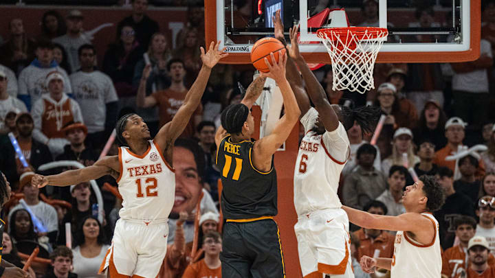 Texas Longhorns guard Tramon Mark (12) and Texas Longhorns forward Arthur Kaluma (6) block a shot from Missouri Tigers guard Trent Pierce (11) as the Longhorns take on Mizzou at the Moody Center on Jan. 21, 2025.