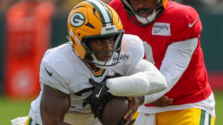 Green Bay Packers running back MarShawn Lloyd (32) takes a handoff in a drill during practice on Tuesday, August 12, 2025, at Ray Nitschke Field in Ashwaubenon, Wis. 
Tork Mason/USA TODAY NETWORK-Wisconsin