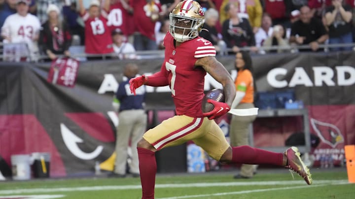 San Francisco 49ers cornerback Charvarius Ward (7) returns an interception for a touchdown against the Arizona Cardinals during the first quarter at State Farm Stadium in Glendale on Dec. 17, 2023.
