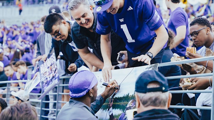 Michael Penix Jr. provides an autograph during the Spring Game.