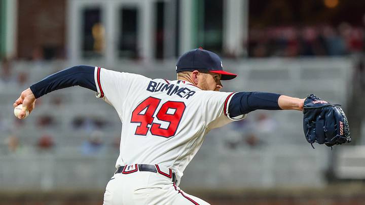 Mar 30, 2026; Cumberland, Georgia, USA; Atlanta Braves pitcher Aaron Bummer (49) pitches against the Athletics during the seventh inning at Truist Park. Mandatory Credit: Jordan Godfree-Imagn Images