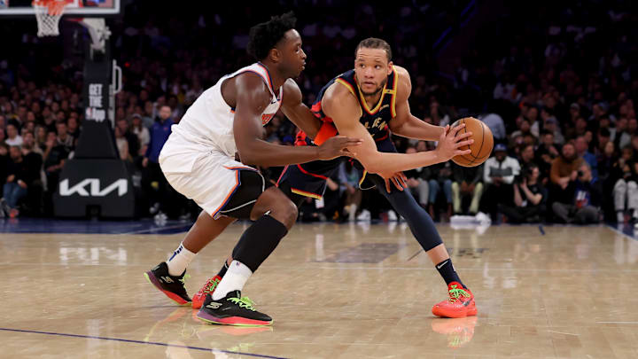 Mar 4, 2025; New York, New York, USA; Golden State Warriors forward Kevin Knox II (31) controls the ball against New York Knicks forward OG Anunoby (8) during the second quarter at Madison Square Garden. Mandatory Credit: Brad Penner-Imagn Images
