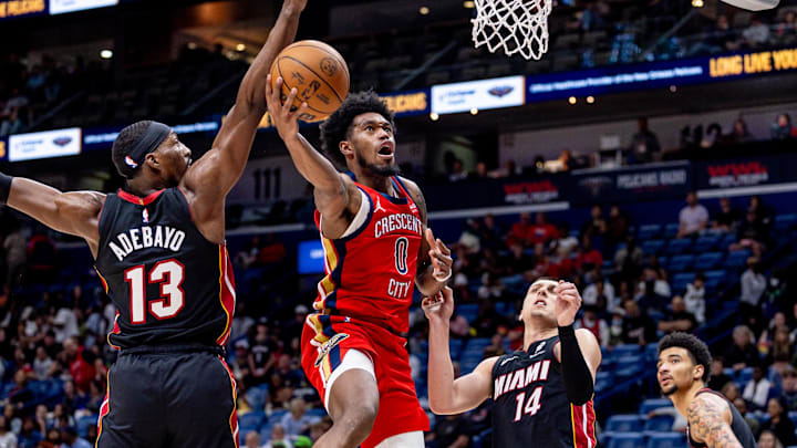 Apr 11, 2025; New Orleans, Louisiana, USA; New Orleans Pelicans forward Keion Brooks Jr. (0) drives to the basket against Miami Heat center Bam Adebayo (13) during the second half at Smoothie King Center. Mandatory Credit: Stephen Lew-Imagn Images Apr 11, 2025; New Orleans, Louisiana, USA; New Orleans Pelicans forward Keion Brooks Jr. (0) drives to the basket against Miami Heat center Bam Adebayo (13) during the second half at Smoothie King Center. Mandatory Credit: Stephen Lew-Imagn Images