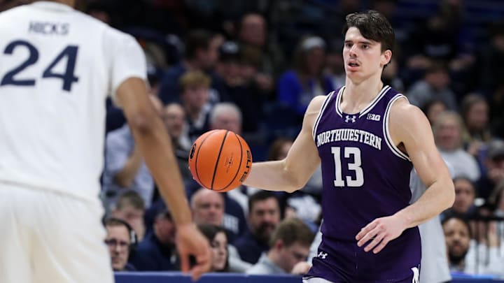 Jan 2, 2025; University Park, Pennsylvania, USA; Northwestern Wildcats guard Brooks Barnhizer (13) dribbles during the second half against the Penn State Nittany Lions at Bryce Jordan Center. Penn State defeated Northwestern 84-80. Mandatory Credit: Matthew O'Haren-Imagn Images