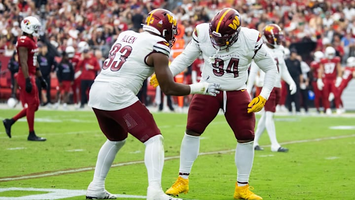 Sep 29, 2024; Glendale, Arizona, USA; Washington Commanders defensive tackle Daron Payne (94) celebrates with teammate Jonathan Allen (93) after sacking Arizona Cardinals quarterback Kyler Murray (not pictured) in the second half at State Farm Stadium. Mandatory Credit: Mark J. Rebilas-Imagn Images