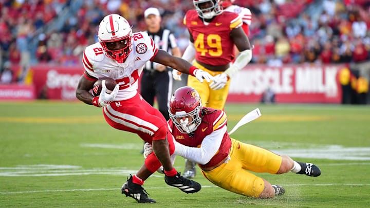 Nov 16, 2024; Los Angeles, California, USA; Nebraska Cornhuskers running back Emmett Johnson moves the ball against Southern California Trojans linebacker Mason Cobb during the second half.