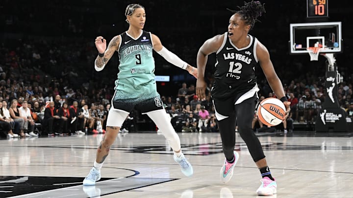Aug 13, 2025; Las Vegas, Nevada, USA; Las Vegas Aces guard Chelsea Gray (12) dribbles against New York Liberty guard Natasha Cloud (9) during the second quarter of their game at Michelob Ultra Arena. Mandatory Credit: Candice Ward-Imagn Images Aug 13, 2025; Las Vegas, Nevada, USA; Las Vegas Aces guard Chelsea Gray (12) dribbles against New York Liberty guard Natasha Cloud (9) during the second quarter of their game at Michelob Ultra Arena. Mandatory Credit: Candice Ward-Imagn Images