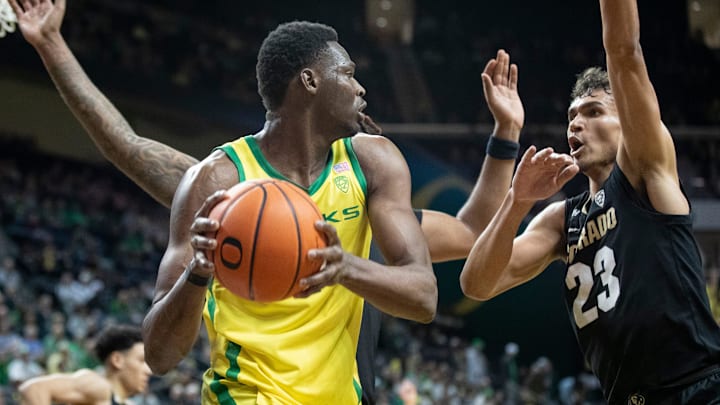 Oregon center N'Faly Dante looks for room to pass as the Oregon Ducks host the Colorado Buffaloes