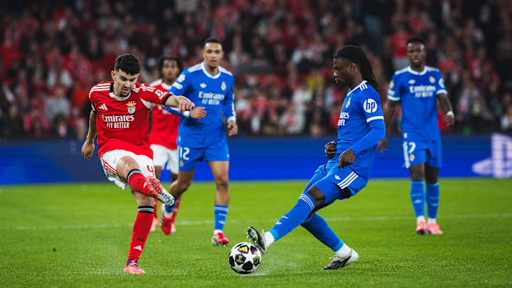 Tomas Araujo of SL Benfica (L) and Eduardo Camavinga of Real...