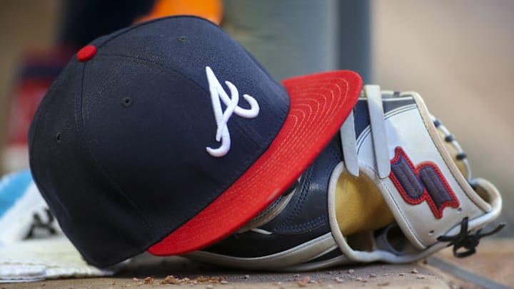 May 31, 2019; Atlanta, GA, USA; Detailed view of hat and glove of Atlanta Braves center fielder Ronald Acuna Jr. (not pictured) against the Detroit Tigers in the fourth inning at SunTrust Park. Mandatory Credit: Brett Davis-Imagn Images