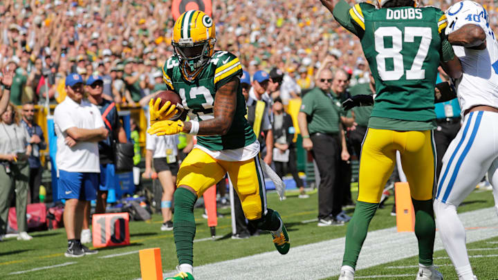Green Bay Packers wide receiver Dontayvion Wicks (13) scores a touchdown in the first quarter against the Indianapolis Colts during their football game Sunday, September 15, 2024, at Lambeau Field in Green Bay, Wisconsin.