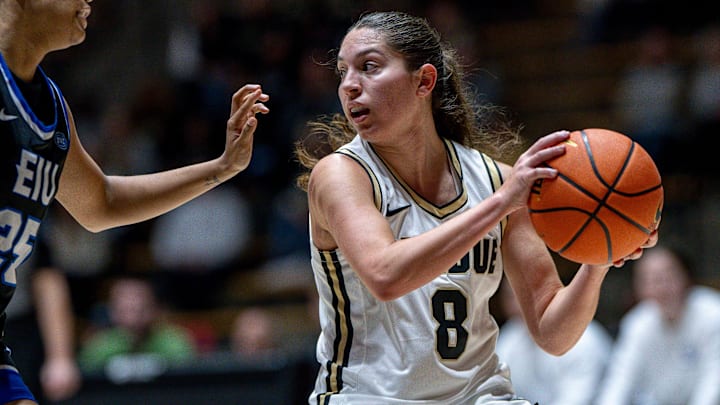Purdue Freshman Hila Karsh (8) looks for a pass 