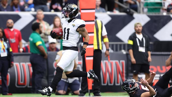 Nov 9, 2025; Houston, Texas, USA; Jacksonville Jaguars wide receiver Parker Washington (11) returns a punt for a touchdown against the Houston Texans during the first half at NRG Stadium. Nov 9, 2025; Houston, Texas, USA; Jacksonville Jaguars wide receiver Parker Washington (11) returns a punt for a touchdown against the Houston Texans during the first half at NRG Stadium.