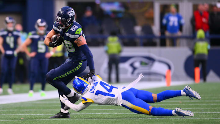 Nov 3, 2024; Seattle, Washington, USA; Seattle Seahawks tight end AJ Barner (88) stiff arms Los Angeles Rams cornerback Cobie Durant (14) after making a catch during the second half at Lumen Field. Nov 3, 2024; Seattle, Washington, USA; Seattle Seahawks tight end AJ Barner (88) stiff arms Los Angeles Rams cornerback Cobie Durant (14) after making a catch during the second half at Lumen Field.