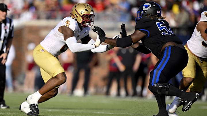 Nov 16, 2024; Dallas, Texas, USA; Boston College Eagles defensive end Donovan Ezeiruaku (6) and SMU Mustangs offensive lineman Savion Byrd (54) in action during the game between the SMU Mustangs and the Boston College Eagles at Gerald J. Ford Stadium. Mandatory Credit: Jerome Miron-Imagn Images