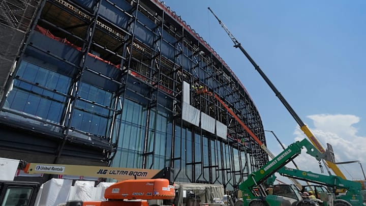 Construction crews install the first panels on the stadium exterior as work continues on the Buffalo Bills new stadium