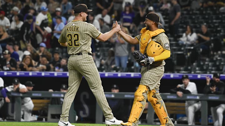 May 10, 2025; Denver, Colorado, USA; San Diego Padres catcher Elias Díaz (17) congratulates San Diego Padres pitcher Stephen Kolek (32) for his complete game and shutout against the Colorado Rockies at Coors Field. Mandatory Credit: John Leyba-Imagn Images