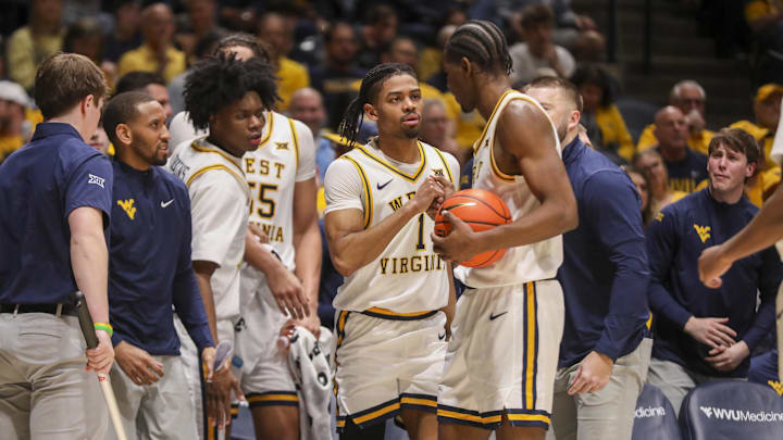 Feb 28, 2026; Morgantown, West Virginia, USA; West Virginia Mountaineers guard Jasper Floyd (1) celebrates with West Virginia Mountaineers forward Brenen Lorient (0) during the second half against the BYU Cougars at Hope Coliseum. Mandatory Credit: Ben Queen-Imagn Images Feb 28, 2026; Morgantown, West Virginia, USA; West Virginia Mountaineers guard Jasper Floyd (1) celebrates with West Virginia Mountaineers forward Brenen Lorient (0) during the second half against the BYU Cougars at Hope Coliseum. Mandatory Credit: Ben Queen-Imagn Images
