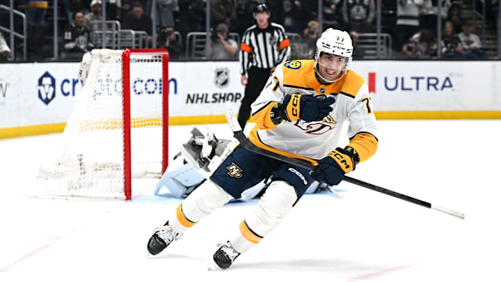 Apr 2, 2026; Los Angeles, California, USA; Nashville Predators right wing Luke Evangelista (77) celebrates after winning the penalty shootout against the Los Angeles Kings at Crypto.com Arena. Mandatory Credit: Griffin Hooper-Imagn Images