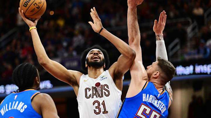 Jan 8, 2025; Cleveland, Ohio, USA; Cleveland Cavaliers center Jarrett Allen (31) drives to the basket against Oklahoma City Thunder center Isaiah Hartenstein (55) during the second half at Rocket Mortgage FieldHouse. Mandatory Credit: Ken Blaze-Imagn Images