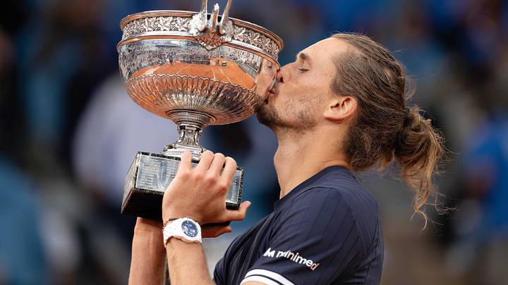 Jun 7, 2026; Paris,  France; Alexander Zverev of Germany kisses the trophy after winning the mens singles final against Flavio Cobolli of Italy on day 15  at Stade Roland Garros. Mandatory Credit: Susan Mullane-Imagn Images