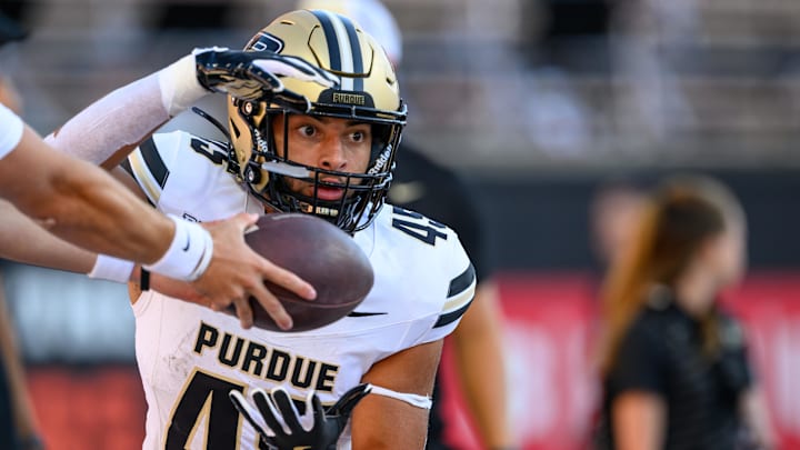 Purdue Boilermakers running back Devin Mockobee (45) takes a handoff