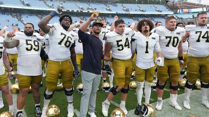 Oct 3, 2026; Chapel Hill, North Carolina, USA; Notre Dame Fighting Irish head coach Marcus Freeman with his team after the game at Kenan Stadium. Oct 3, 2026; Chapel Hill, North Carolina, USA; Notre Dame Fighting Irish head coach Marcus Freeman with his team after the game at Kenan Stadium.